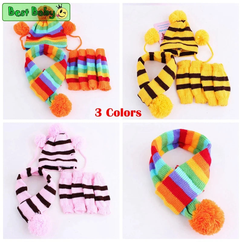 Set of colorful pet hats, scarves with pom-poms and leggings, displayed against a white background.