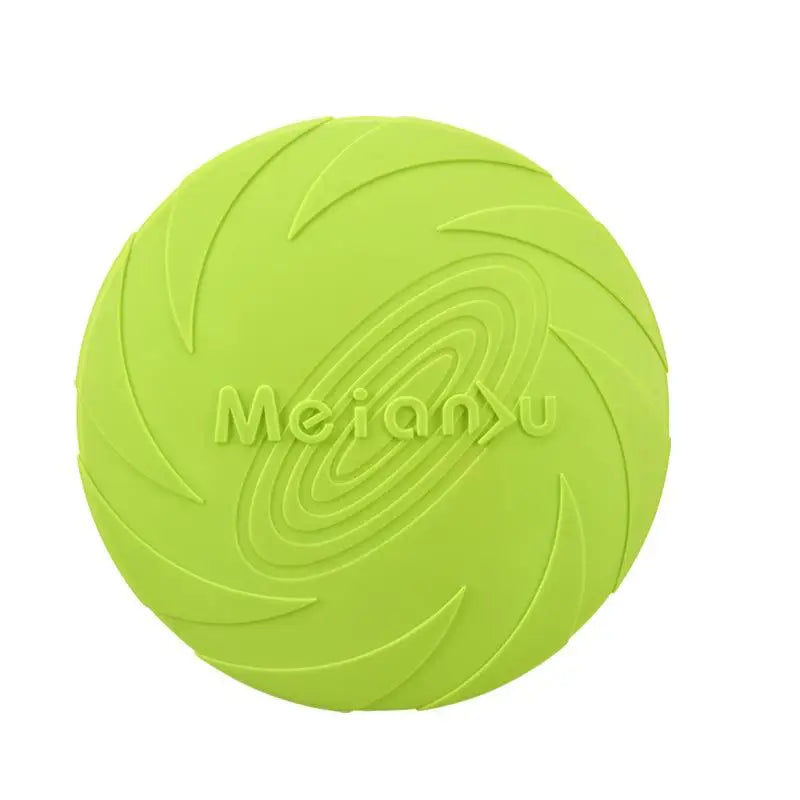 A dog catching a blue flying disc with more discs in orange and purple lying on the ground.