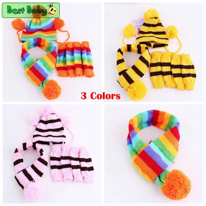 Set of colorful pet hats, scarves with pom-poms and leggings, displayed against a white background.