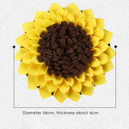 Sunflower-shaped decorative item with yellow petals and brown center on a light gray background