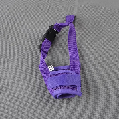 A dog muzzle in purple color, made of nylon, shown both alone 